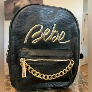 Bebe NWT black and gold purse backpack